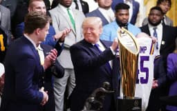 Will Trump say "Crypto" or "Bitcoin" during NCAA National Champions remarks on April 21?