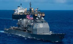 US escorts commercial ship through Hormuz by April 15?